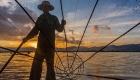 photo of a fishermen with fishing nest