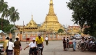 photo of people walking and a tishaw at Bohtataung Pagoda