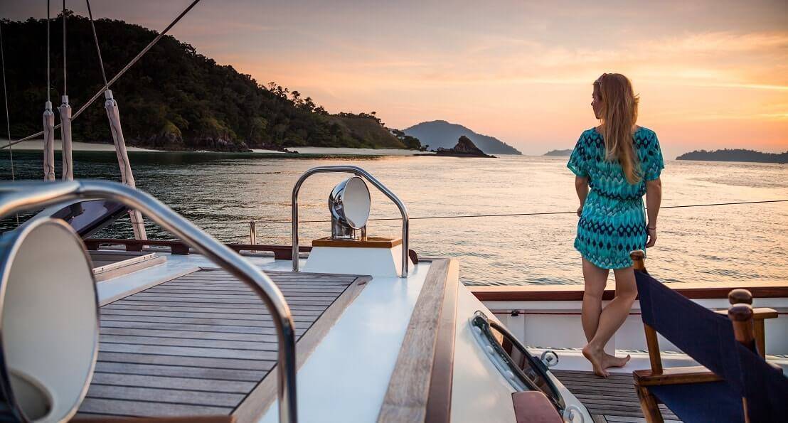 photo of a lady standing on the yacht