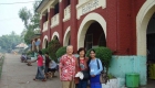 photo of three people in train station