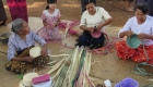photo of women making bamboo hat