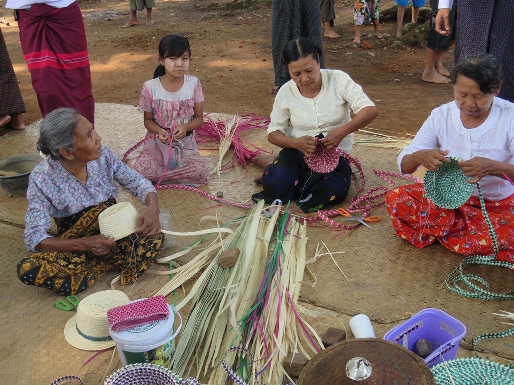 photo of women making bamboo hat