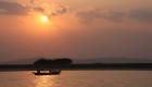 photo of Ayeyarwaddy river boat with sunset view