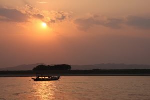 photo of Ayeyarwaddy river boat with sunset view