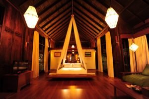 photo of bed in villa room with lights in Villa Inle Resort & Spa