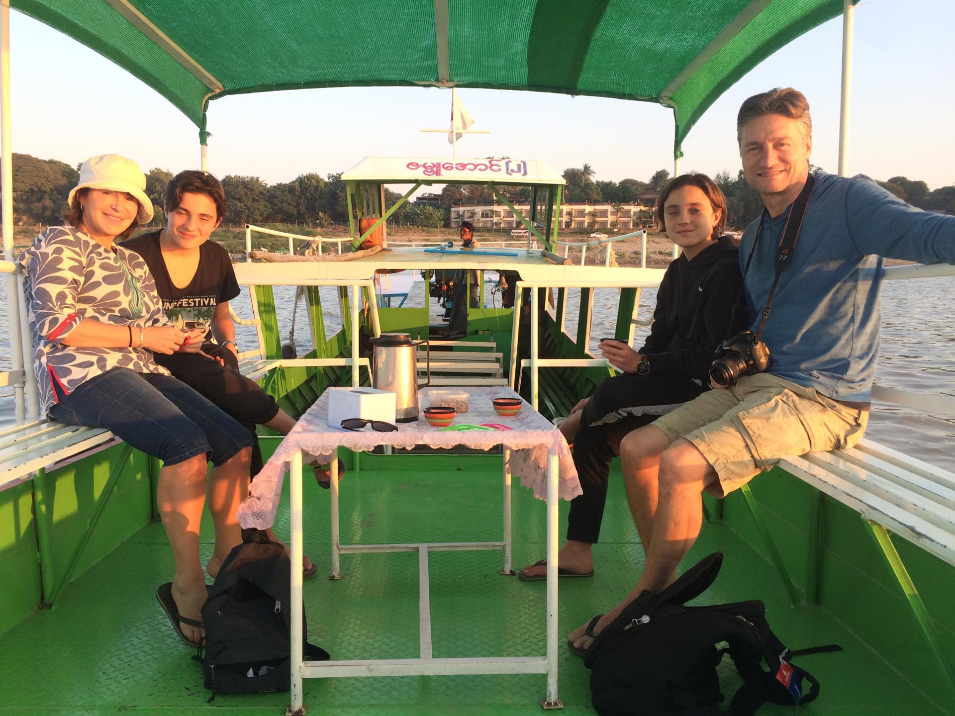 photo of a four family on a boat